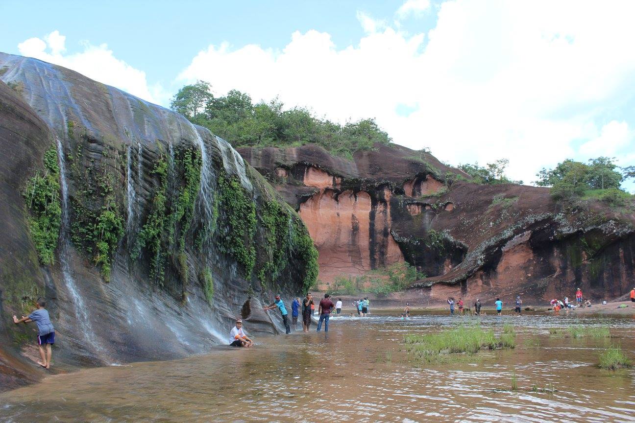 Thais enjoying a waterfall