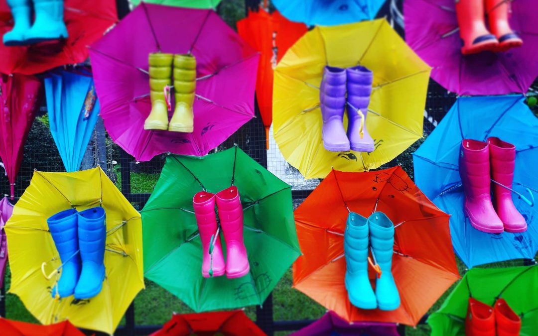 monsoon season decorations in Thailand colorful rainboots and umbrellas