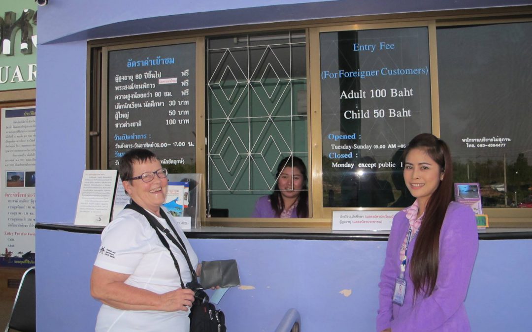 local Thailand guide helping volunteer Helga get her visa at the Thai Laos border