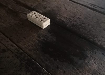 an outlet near a leak in a home in poverty