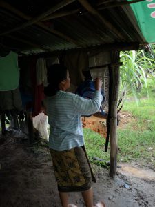 Nuan prepares her son's backpack