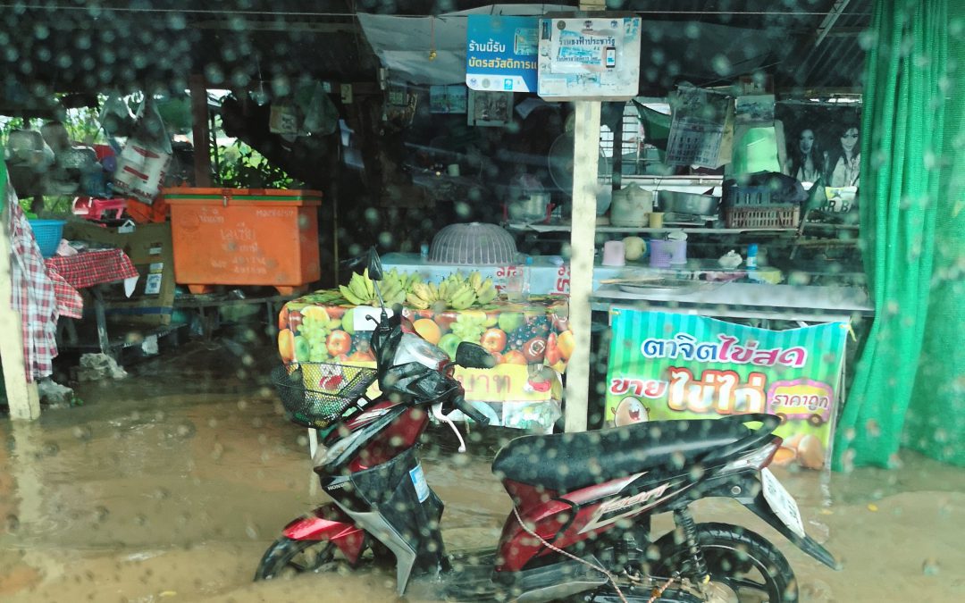 motorbike on the street submerged in water during monsoon season