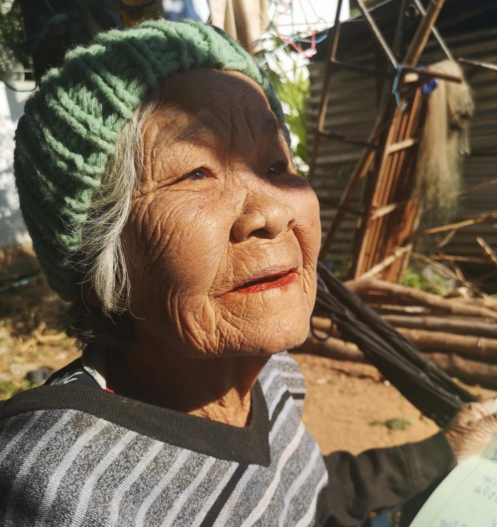close up of elder yaai with her new green knitted hat