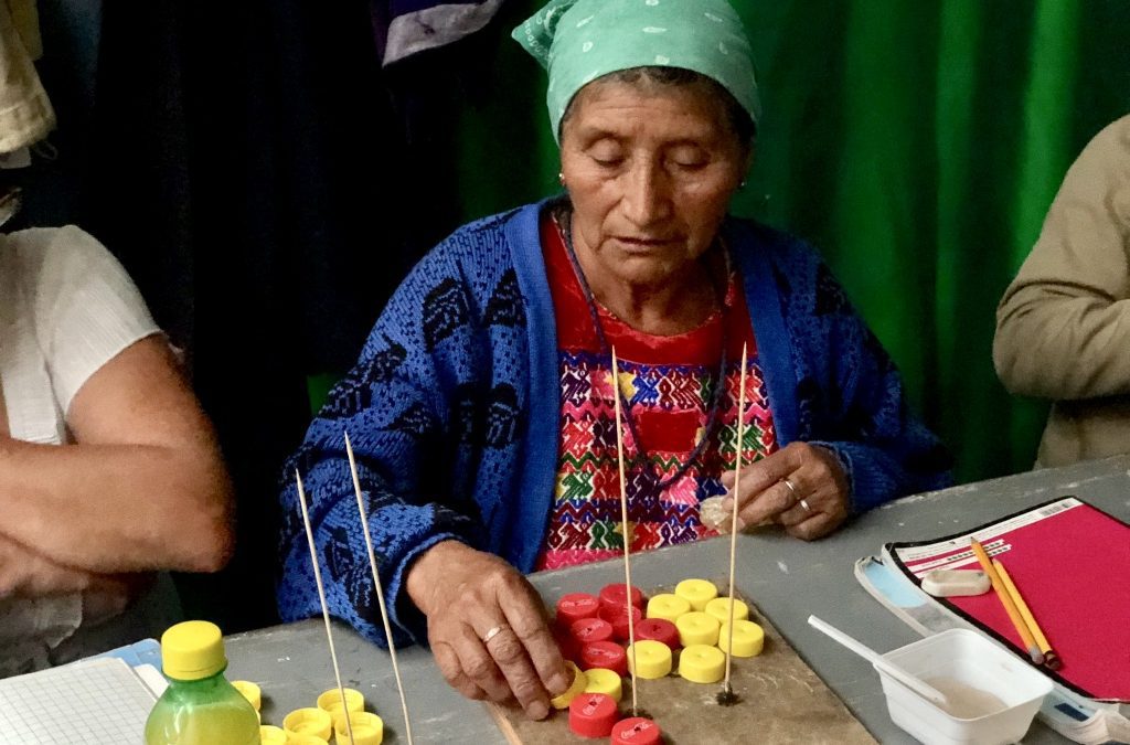 adult literacy guatemala woman doing a counting activity