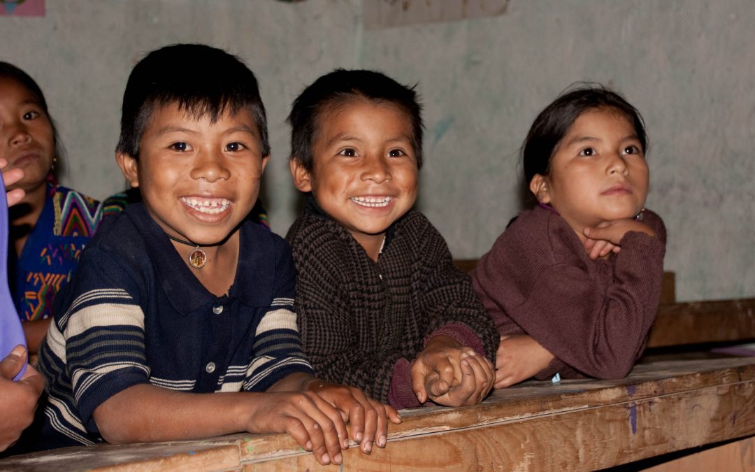 funded educational Center for Ixil kids three young students in the classroom