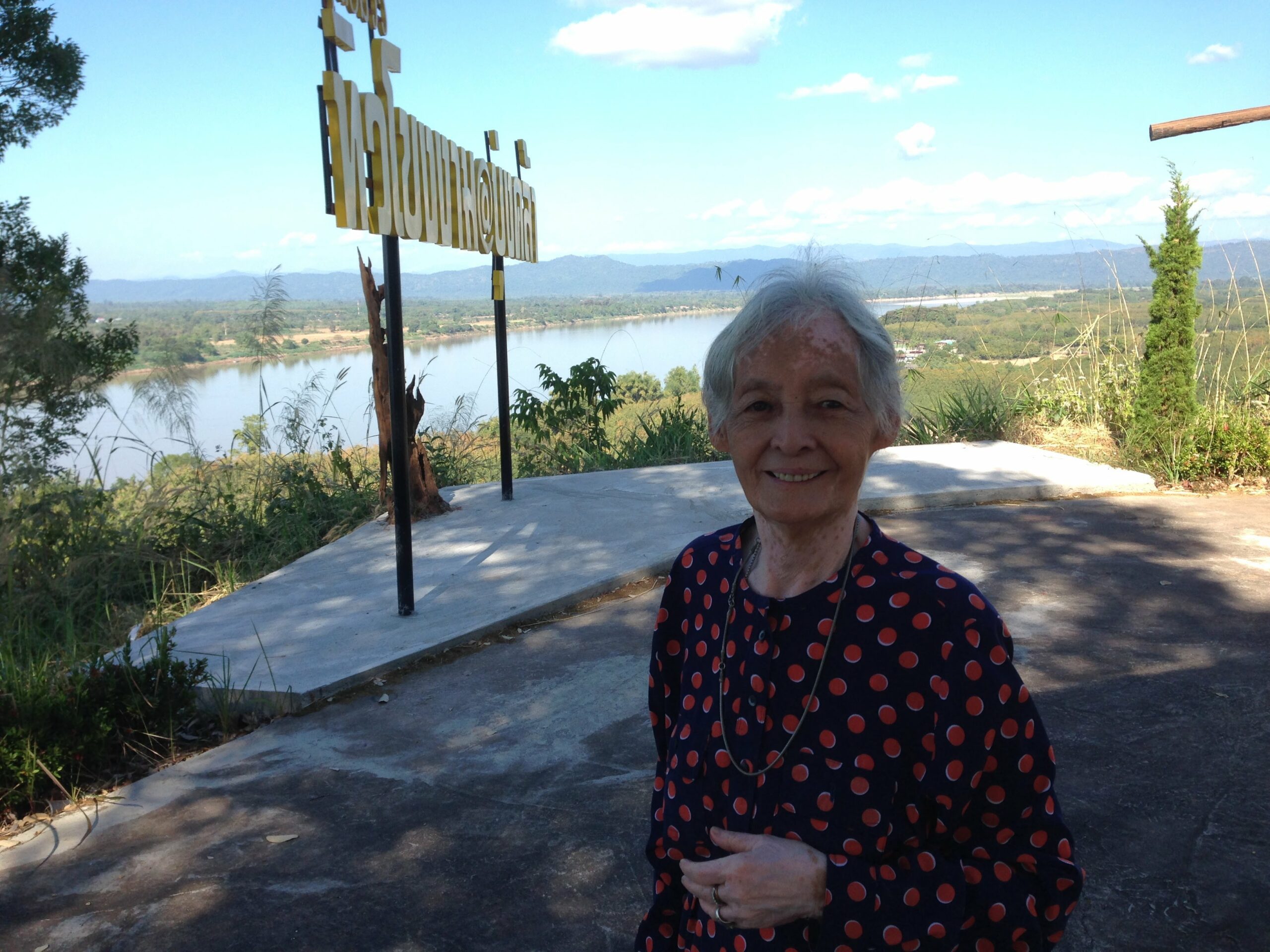 vanida standing near the mekong river